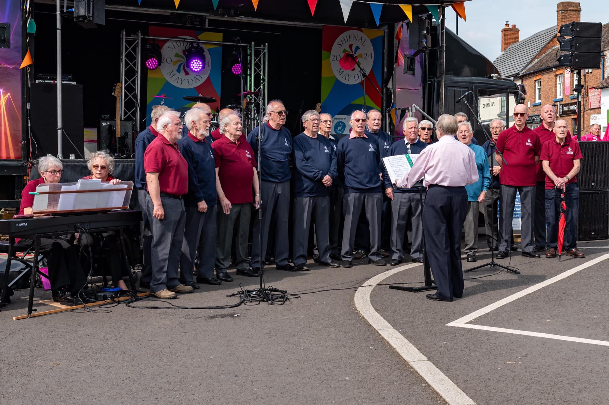 Shifnal & District Male Voice Choir performing at Shifnal May Day 2024